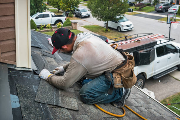 Professional Roofing technician working in Fitchburg, MA